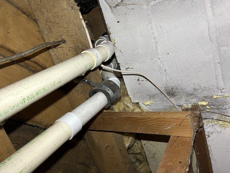 Diagnosed and repaired no heat condition on recently installed furnace. Found two issues: improperly pitched exhaust piping was corrected by cutting and re-gluing with proper slope back to unit, and cleared blockage in condensate drain system that had caused inducer motor to fill with water. Restored proper drainage and verified normal heating operation after repairs.