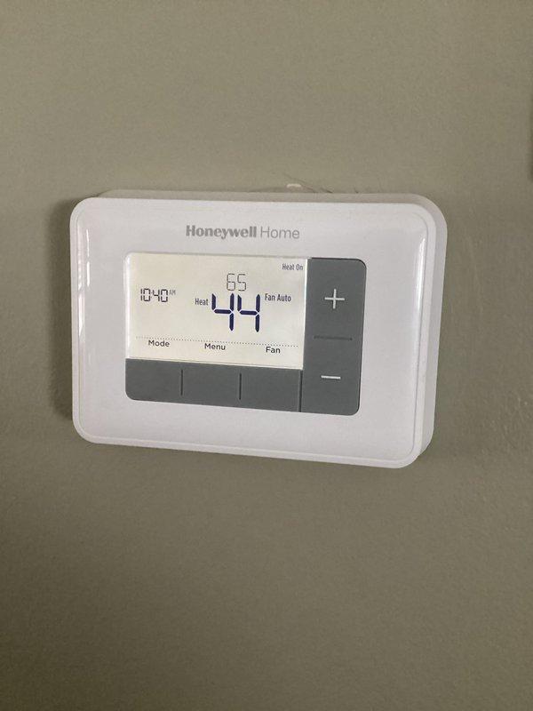 Saint Paul Park, MN - Diagnosed non-operational furnace due to dead thermostat batteries. Replaced batteries and verified system operation. Furnace restarted successfully with thermostat now displaying proper temperature (44°). Advised customer about potential condensate trap freezing in high-efficiency unit and recommended maintaining home temperature above 55°.