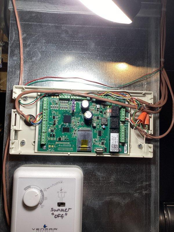 Diagnosed zone control system failure causing inadequate heating in upstairs zone (Zone 2). Testing revealed thermostat communication issues with zoning system, leading to heating deficiency and excessive window condensation. Determined zone control board is malfunctioning with intermittent power cycling; recommended replacement of zone control board and upstairs zone thermostat.