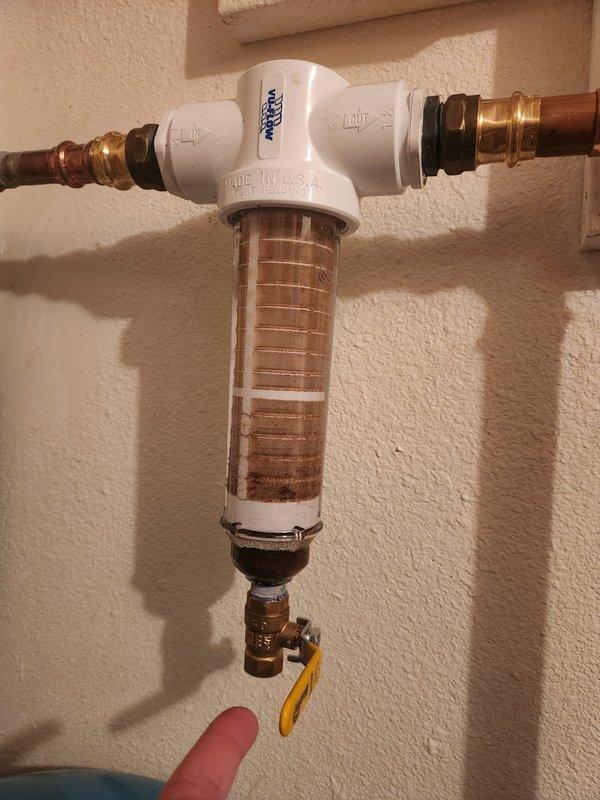 Responded to warranty service call for recently installed water treatment system. Installed a hose adapter to existing ball valve on filtration unit, allowing customer to properly flush the softener tank without water spillage.