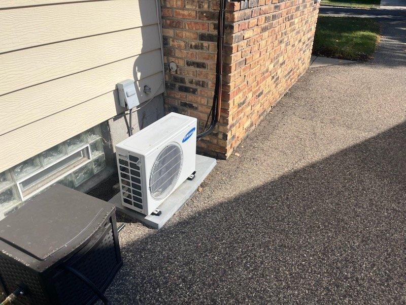 Responded to no cooling complaint for aging Samsung mini split system. Diagnostic testing revealed complete power loss to the unit, which was also noted to be extremely dirty. Scheduled follow-up appointments for both an electrician to inspect the electrical box and a sales appointment for Tuesday to address the system's condition.