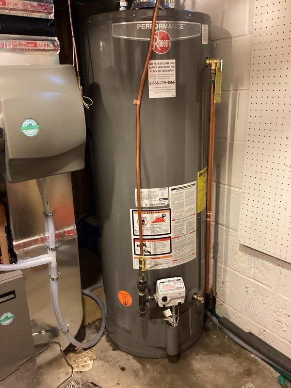 Replaced customer-supplied Rheem Performance water heater (Model #XG50T06EC38U1) after original Bradford White unit developed tank leak. Installation included connecting all plumbing lines and testing system. Post-installation inspection confirmed proper operation with no leaks detected.