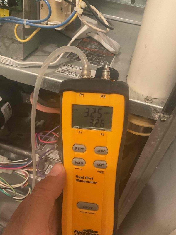 Performed annual maintenance on 13-year-old furnace including filter replacement (16x20x1) and comprehensive tune-up. Diagnostic testing with dual port manometer showed pressure readings of 3.25/3.26. Replaced dirty filter to restore proper airflow and system efficiency.