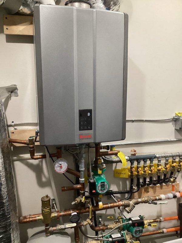 Responded to a no-heat service call for a downflow furnace that was cycling on but shutting down prematurely due to pressure switch issues. Identified water in the inducer assembly caused by a condensate line clogged with PVC shavings from installation. Cleared the blocked drain lines, removed water from inducer, and restored normal heating operation. Discussed future improvements including new lineset installation for AC issues, thermostat relocation, and proper mini-split positioning in 4-season room.