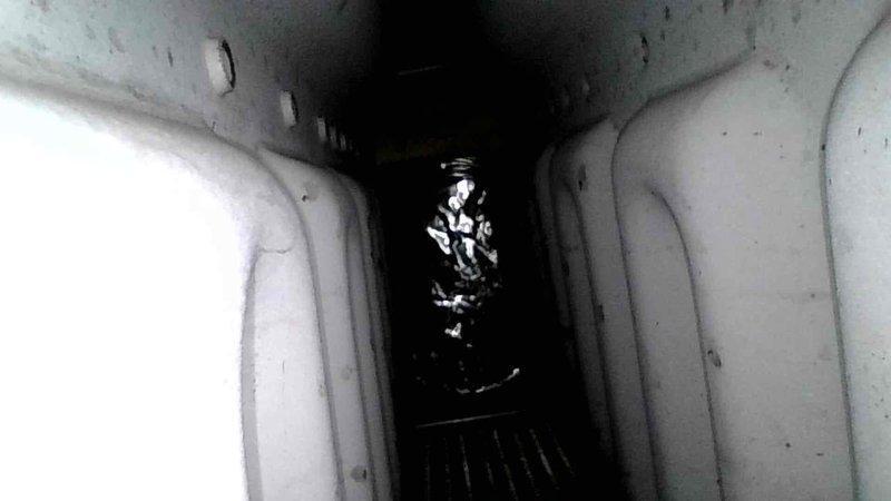 Diagnosed 13-year-old Comfort Maker furnace making unusual burner noise and identified failing combustion blower bearing. Inspected heat exchanger and noted suspect areas but no current penetration. Advised customer against investing in replacement parts due to age of unit and common heat exchanger failure pattern with this model. Scheduled service advisor visit for replacement options.