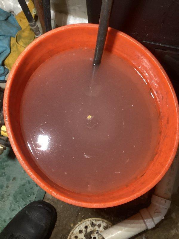 Responded to service call for non-functional upper level heat and system noise. Found low water pressure causing excessive wear on primary pump and air-locked zone pumps. Added water to system, purged air from loops, and restored proper pump operation. Set system pressure to 17 psi. Noted discolored water with oxygen bubbles throughout system. Recommended Fernox Treatment and replacement of primary pump due to wear.