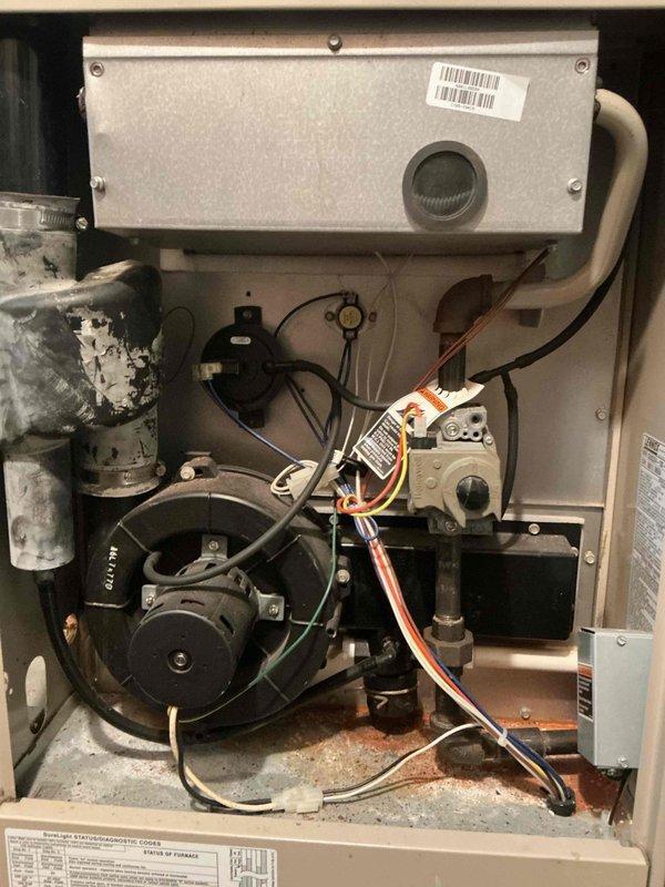 Performed inspection on Lennox natural gas furnace that was unexpectedly shutting down. Diagnostic testing revealed a failed heat exchanger requiring system reset. Documented condition with photos showing internal component wear and attached appropriate warning tag. Recommended replacement estimates for both furnace and AC system.