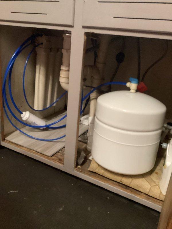 Responded to follow-up service call for previously identified frozen/burst pipes. Completed repairs to hot and cold water lines at laundry box, installed new vanity faucet in upstairs bathroom, removed secondary kitchen drain trap, and replaced main floor toilet shut-off valve. All leaks have been successfully addressed and plumbing systems are now functioning properly.