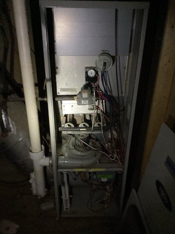 Responded to no heat complaint for intermittent furnace operation. Diagnostic inspection revealed three critical issues: faulty fan timer, inconsistent pilot ignition, and a significant crack in the heat exchanger faceplate above the burners. Due to the cracked heat exchanger presenting a safety hazard, the unit was tagged out of service and customer advised that system replacement is necessary rather than repair.