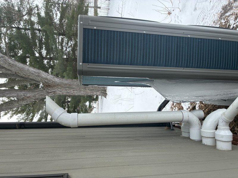 Responded to no hot water complaint after recent installation. Upon arrival, system was operating normally at correct temperature. Customer had previously reset power switches which likely resolved the intermittent heating issue. Inspected HTC water heater and associated components - all functioning properly with good connections. Modified exterior exhaust pipe to improve venting and ensure proper system operation.