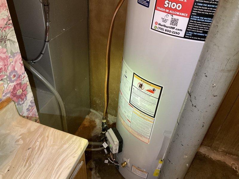 Successfully installed a 50-gallon natural gas standard vent water heater, replacing the existing unit. Installation included proper connection of copper pipes, ventilation components, and ensuring all safety requirements were met. Total job duration was approximately 4-5 hours.