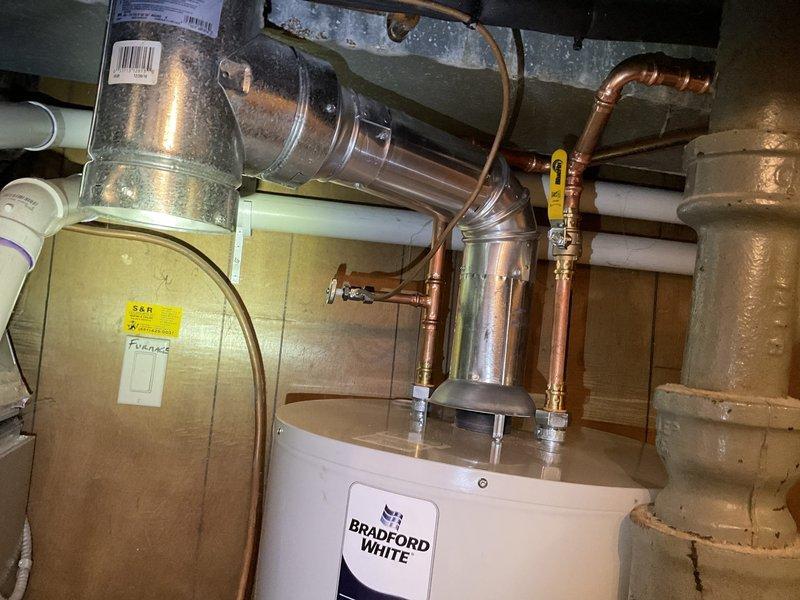 Successfully installed a 50-gallon natural gas standard vent water heater, replacing the existing unit. Installation included proper connection of copper pipes, ventilation components, and ensuring all safety requirements were met. Total job duration was approximately 4-5 hours.