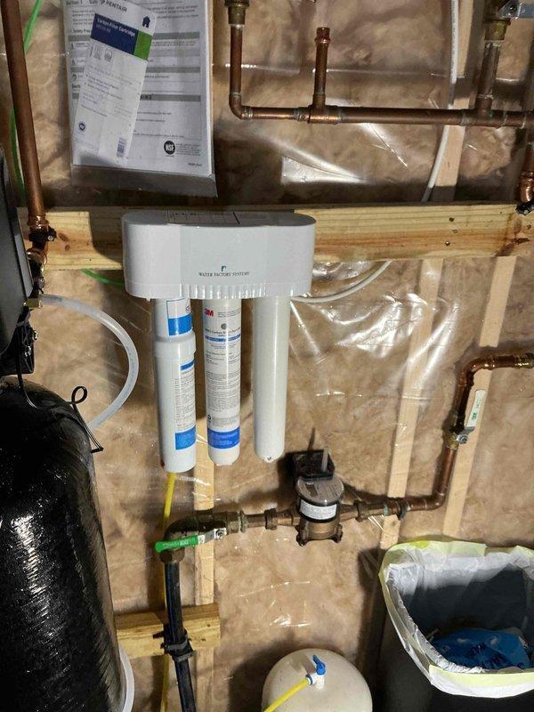 Roberts, WI - Replaced incorrect RO filters in Bradford White water heater system with proper specification filters. System was drained and new filters installed to restore proper filtration functionality.