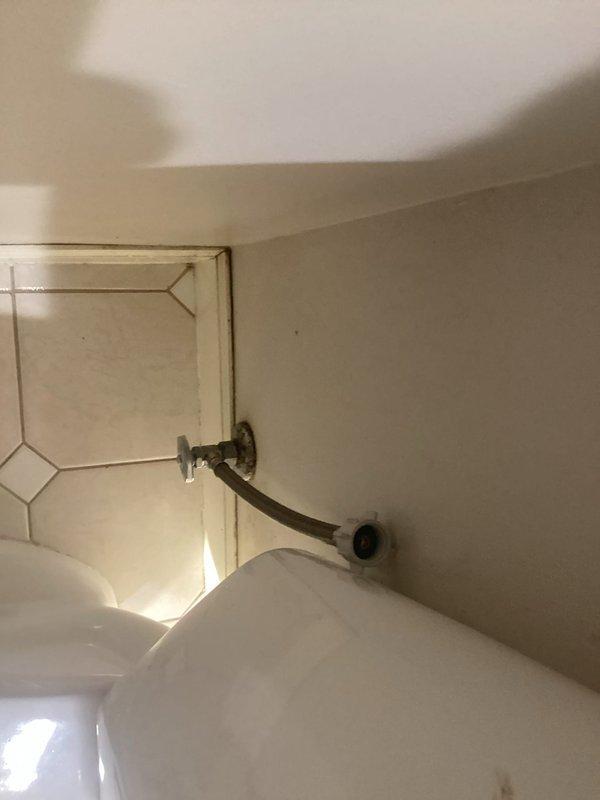 Responded to service call for toilet leak. Found water supply valve and line both leaking. Replaced defective angle stop valve and installed new supply line, resolving the continuous water leakage issue.