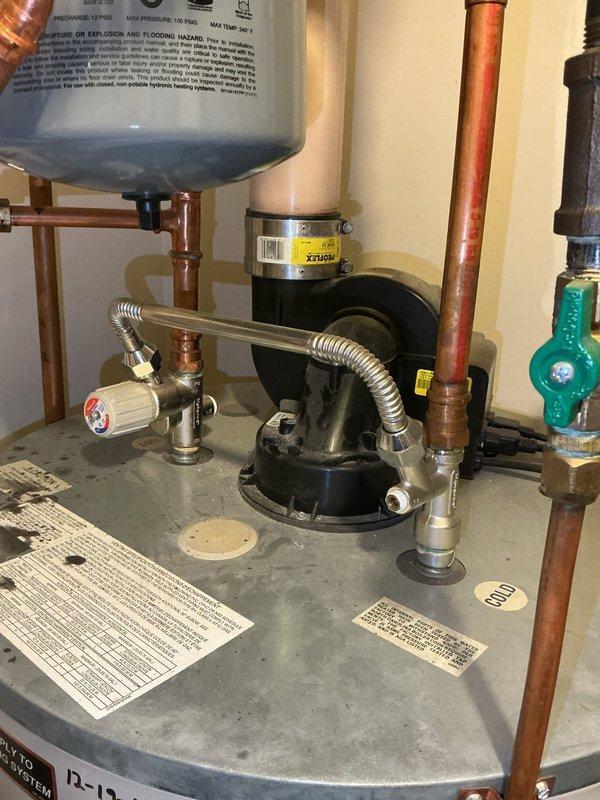Responded to service call for non-functional boiler. Diagnosed failed power vent blower on combination tank water heater preventing system startup. Replaced power vent blower assembly, restoring proper operation of heating system and domestic hot water.
