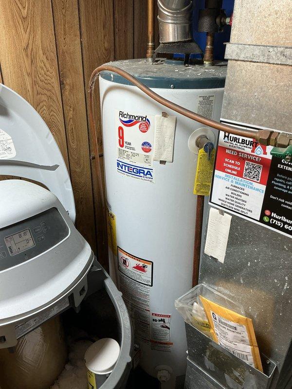 Diagnosed water softener experiencing salt bridging issue (salt dam), preventing proper regeneration cycles. Inspected adjacent Richmond Integra water heater and Gibson HVAC system to ensure no related issues. Scheduled follow-up appointment to perform complete service on water softener and provide customer with water heater replacement options.