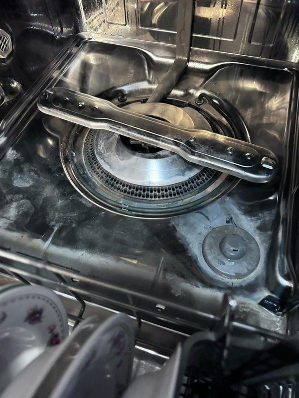 Responded to customer complaint of water leakage from dishwasher. Conducted thorough inspection of unit and surrounding area, noting water staining at floor junction near appliance base. Examined internal components including spray arm assembly and water distribution mechanisms. Despite inspection efforts, could not replicate leaking issue during diagnostic testing. Recommended replacement of dishwasher as most appropriate solution.