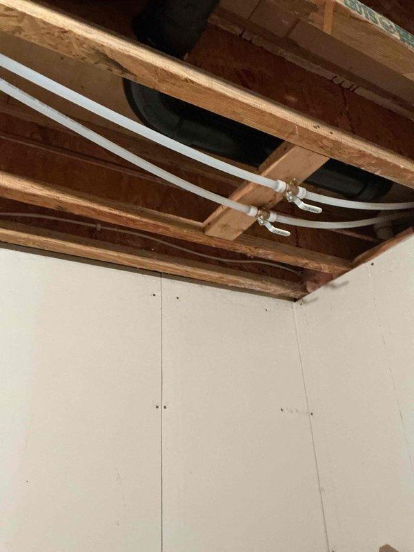 Responded to complaint of loud humming noise occurring when toilets are flushed in a well-supplied residence. Identified vibration in the cold, soft water line within the mechanical room as the source of noise transmission throughout the house. Removed support clamps securing copper lines to wooden framing members, which eliminated the vibration issue. Instructed customer to contact if noise recurs.