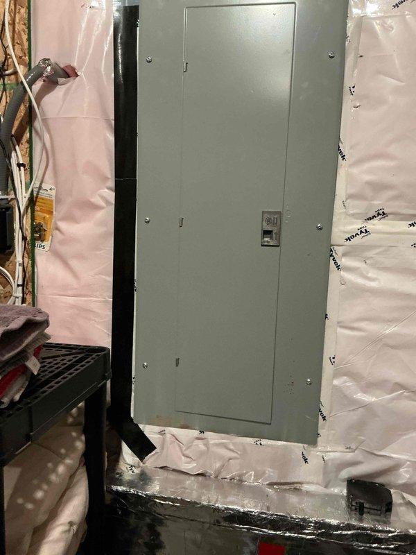 Responded to customer complaint of washing machine drain backing up after multiple loads. Upon inspection, determined main drain and washing machine drain were functioning properly. Identified actual issue was water softener discharge hose not properly inserted into floor drain, causing water to spill onto mechanical room floor during regeneration cycles. Corrected by properly securing softener discharge hose into floor drain to prevent future flooding.