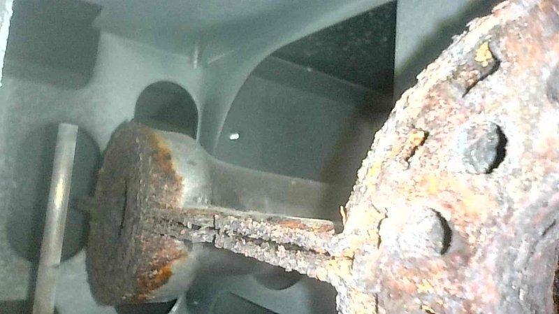 Responded to follow-up call for previously serviced heat pump not working. Upon arrival, system was operational but inspection revealed completely clogged filter with ultrasonic humidifier dust; removed filter which improved system performance. Noted significant rust and corrosion on burners (documented with photos) and recommended replacement of these components in the near future.