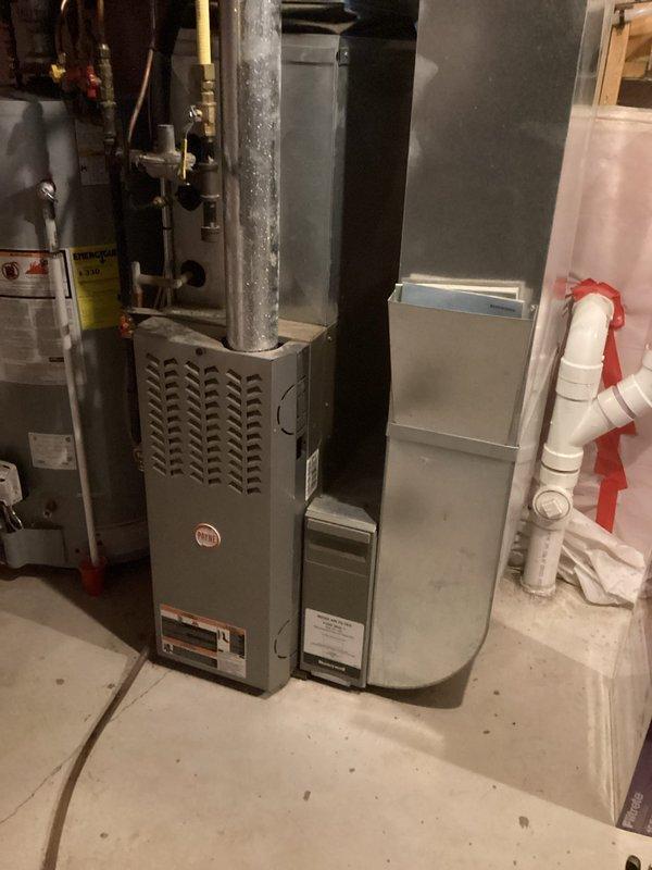 Performed scheduled furnace maintenance under annual agreement. Inspected heat exchanger (noted minor rust spots - not concerning), cleaned flame sensor, and observed slightly dusty but functional blower wheel. Tested gas pressure and temperature drop - both within specifications. System operating normally; recommended filter inspection in one month.