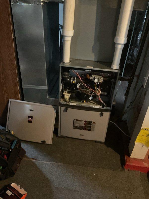 Responded to no-heat emergency call where customer reported loud buzzing noise from furnace. Diagnostic testing revealed failed blower motor with worn bearings preventing proper operation. Heat exchanger was inspected and confirmed to be in satisfactory condition. Replaced defective blower motor and capacitor, then performed system testing to verify proper operation and restoration of heat.