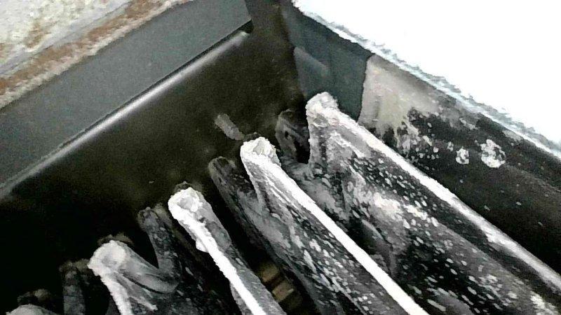 Responded to no-heat call for 2008 Payne propane furnace which was found in high limit lockout. Identified severely clogged air filter with white dust from ultrasonic humidifier use as root cause of airflow restriction and overheating. Cleaned flame sensor, confirmed proper condensate drainage, and verified heat exchanger condition (which had been previously replaced). System restored to proper operation after service; recommended more frequent filter changes or alternative humidifier type to prevent future issues.