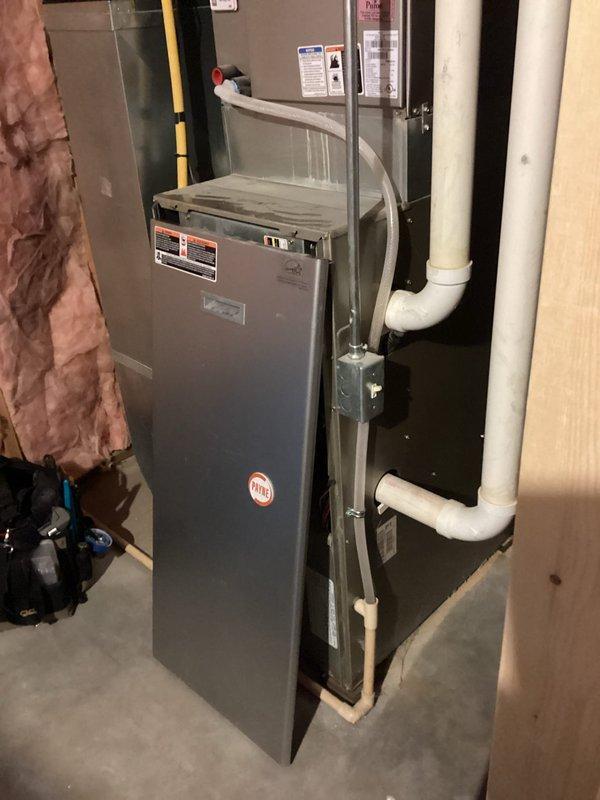 Responded to no-heat call for 2008 Payne propane furnace which was found in high limit lockout. Identified severely clogged air filter with white dust from ultrasonic humidifier use as root cause of airflow restriction and overheating. Cleaned flame sensor, confirmed proper condensate drainage, and verified heat exchanger condition (which had been previously replaced). System restored to proper operation after service; recommended more frequent filter changes or alternative humidifier type to prevent future issues.