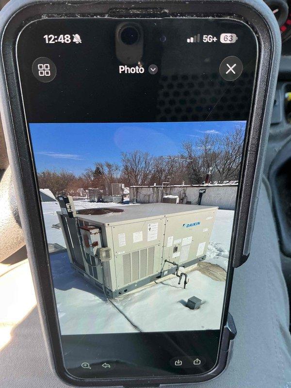 Completed scheduled filter replacement maintenance on two rooftop units (Daikin RTUs) per maintenance agreement. Replaced four 16x16x2 filters and two 20x25x2 filters, then dated all new filters for tracking purposes. Documented completion with photos of equipment.