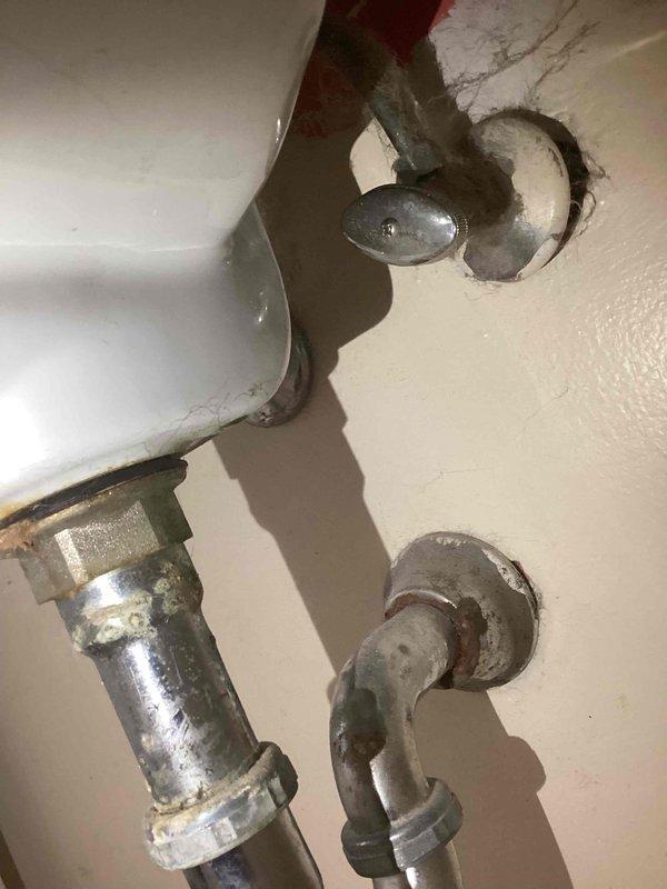Diagnosed and repaired a slowly dripping bathroom vanity faucet by identifying a leaking hot water cartridge. Inspected the plumbing connections under the sink, which showed signs of aging with some corrosion on the supply lines, and ordered replacement parts to complete the repair.