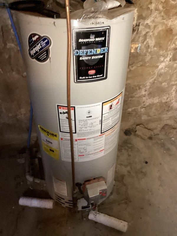 Performed comprehensive outdoor wood boiler tune-up service, identifying loose door rope, lubricating door solenoid and hinges, and noting chimney beginning to plug. Inspected indoor components including coils (found evaporator beginning to soil), heat exchanger (no compromises), and verified proper water levels and pump operation. Secondary furnace inspection revealed cracked collector box and noisy inducer motor; recommended follow-up for replacement/repair options.