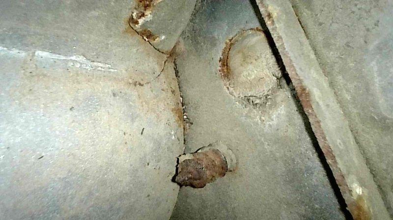 Responded to no heat call for 15+ year old furnace blowing cold air. Diagnostic inspection revealed multiple critical failures including snapped blower motor bracket, cracked inducer disc, and extensive heat exchanger cracking with visible corrosion documented in photographs. Due to safety concerns and multiple component failures, provided replacement options and scheduled service advisor for follow-up consultation.