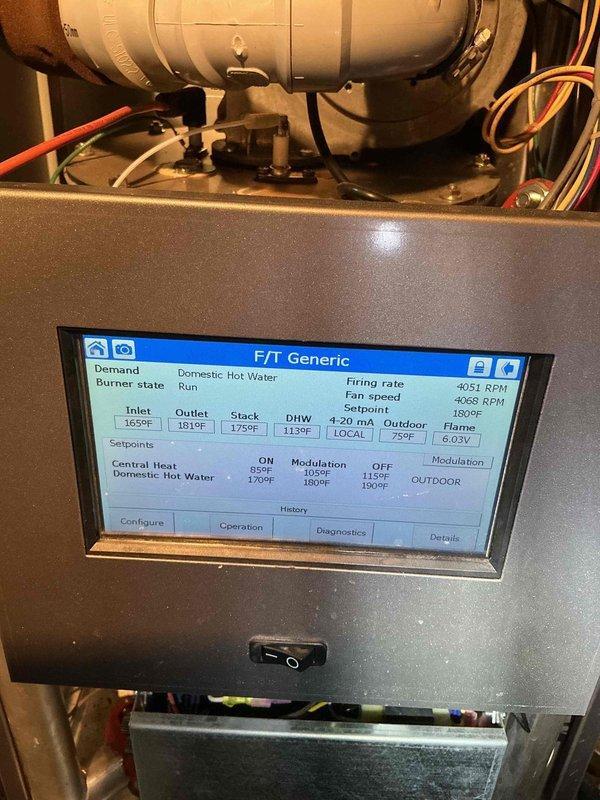 Responded to service call for a leaking boiler. Inspected F/T system showing proper temperature readings (inlet 165°F, outlet 181°F, stack 175°F) with DHW at 113°F. Adjusted settings on the FTT-Console to resolve the leaking issue, confirming proper operation with firing rate at 4051 RPM and fan speed at 4068 RPM.