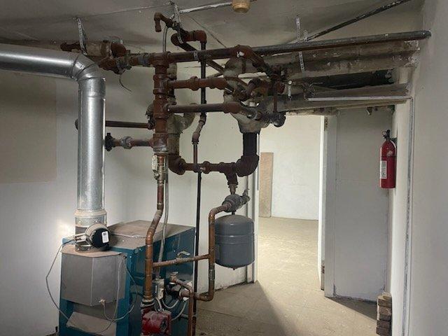 Responded to no heat call on Burnham Series 2 boiler with temperature not rising above 57 degrees. Upon arrival, confirmed thermostat was calling for heat but high limit switch remained open, preventing burner operation. Diagnosed faulty high limit control causing system lockout, replaced defective limit switch, and restored proper boiler operation with system now heating to setpoint.