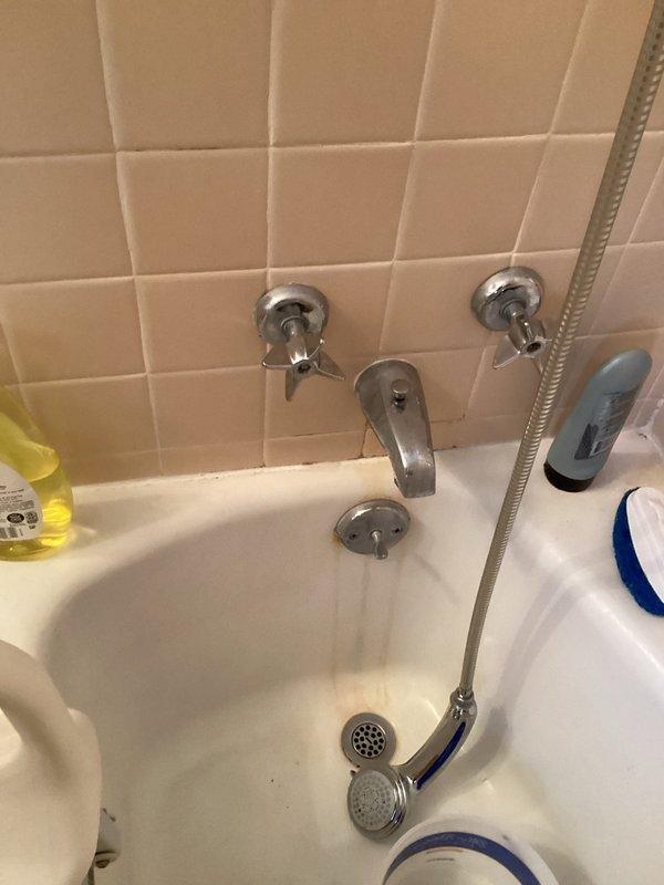 Saint Paul, MN - Responded to water leak complaint following recent shower and tub piping replacement. Upon inspection, identified leaking tub spout as the source of water running down the side of the tub, unrelated to the previously replaced piping. Determined that both faucet handles and cartridges required replacement due to wear and deterioration. Recommended complete replacement of handles and internal cartridge assemblies to resolve the leak and restore proper function to the bathtub fixture.