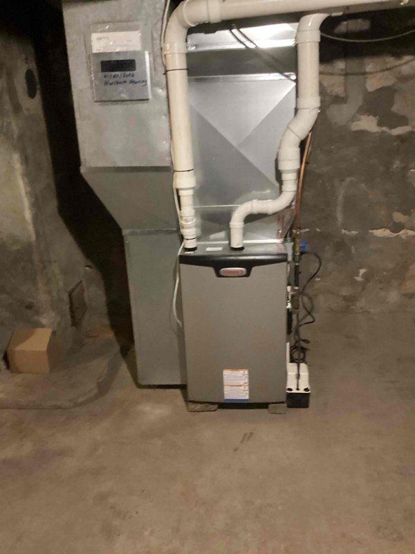 Responded to follow-up call regarding dripping noise in laundry room after previous burst pipe repair. Upon inspection, identified two sources of water leakage: a loose washing machine supply hose connection and a cracked slip nut on the laundry tub drain assembly. Tightened the washing machine hose to proper torque specifications to eliminate leak at connection point. Replaced the damaged slip nut and deteriorated tee gasket on the laundry tub drain system with new components to restore proper seal and prevent further water intrusion. Verified all connections were secure and leak-free before restoring water supply to the home.