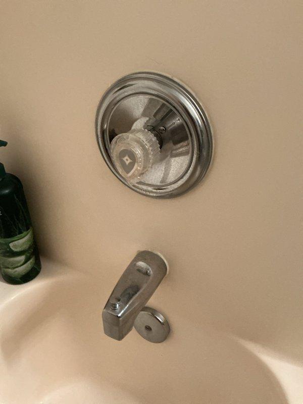 Responded to service call for dripping shower with running spout and unusual noises. Upon inspection, diagnosed faulty shower valve cartridge and defective tub spout causing the water leak and operational issues. Documented existing conditions with photographs showing the chrome shower valve assembly with exposed cartridge mechanism and the tub spout diverter. Provided bid for replacement of both the shower cartridge and spout assembly to restore proper function and eliminate the dripping condition.