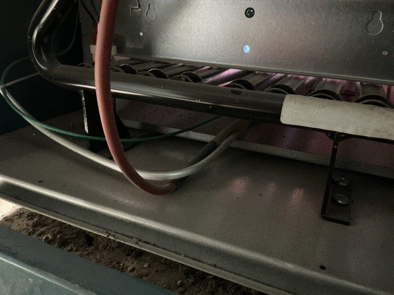 Returned to site following chimney repair to restart boiler system that had been shut down due to exhaust spillage from chimney cave-in. Reset exhaust spill switch and performed system restart procedures. Verified proper venting and combustion operation. Boiler is now fully operational with all safety controls functioning correctly.