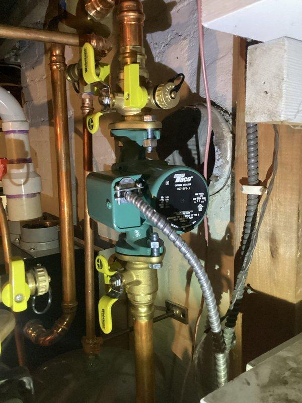 Responded to no heat call on hydronic heating system with boiler installed in January. Replaced defective Taco circulator pump that was part of original installation, covered under parts and labor warranty. Purged air from the system to restore proper circulation and heat distribution throughout the home, resolving the recurring heating issues.