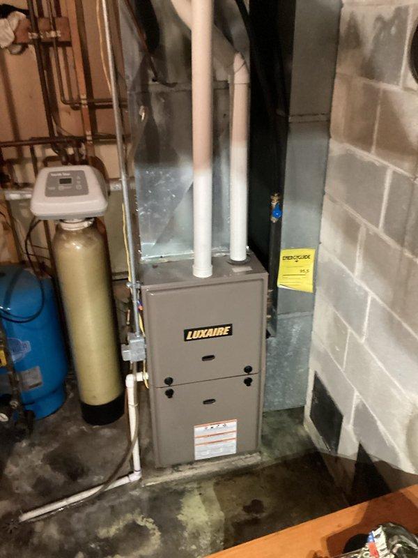 Performed comprehensive tuneup on Luxaire gas furnace for new customer. Thoroughly inspected heat exchanger with no defects found, cleaned condensate system and burners, and verified proper operation. Noted outdoor Guardian AC unit requires leveling; customer will schedule AC service in spring when weather permits.