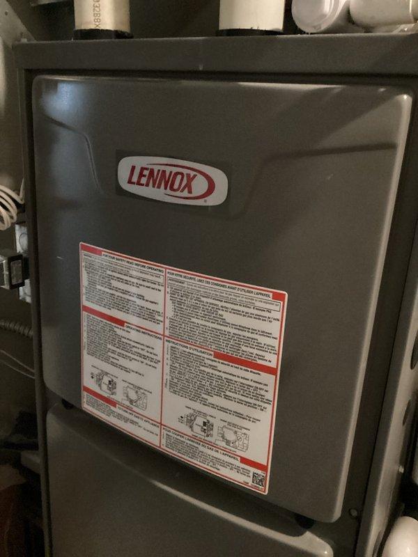 Responded to no-heat call for 5-year-old Lennox gas furnace (Model C35-24B-2F-2) which was not operating despite thermostat being set to heat. Diagnosed issue with hot surface ignitor not lighting. Inspected and cleared bugs from condensate lines and drain, then verified proper system operation through cycling test. System now functioning normally with proper ignition sequence and heating capability restored.