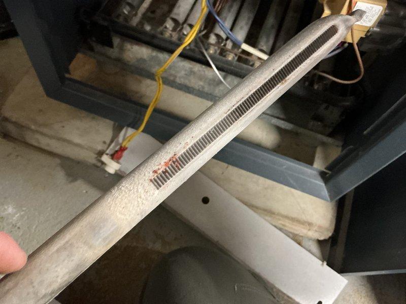 Performed 8-12 tune-up and cleaning on 30+ year old boiler that was failing to maintain temperature above 60 degrees. Cleaned burners and burner chamber, but discovered severely plugged and deteriorating heat exchanger with dangerous CO readings (over 100 ppm in flue, 2 ppm leakage outside jacket). System operating at sub-70% efficiency with buzzing transformer/relays and leaking gate valve. Recommended immediate boiler replacement due to safety concerns.