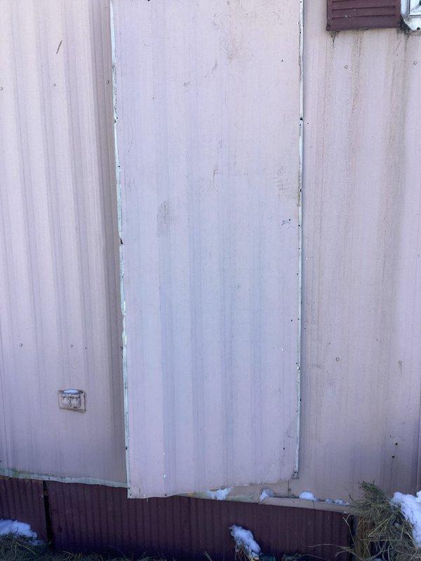 Installed customer-supplied water heater in mobile home, converting from electric to gas system. Observed significant mineral/sediment buildup around kitchen faucet and provided estimate for replacement, which customer declined.