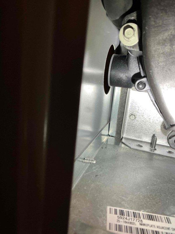 Responded to customer report of water pooling in Lennox furnace cabinet (1-year-old unit). Discovered water accumulation in front left corner with no visible active leaks. Performed maintenance by tightening hose clamps on draft motor exhaust collar and securing draft motor bolts. Dried affected area and monitored for continued leakage; customer advised to document if issue recurs.