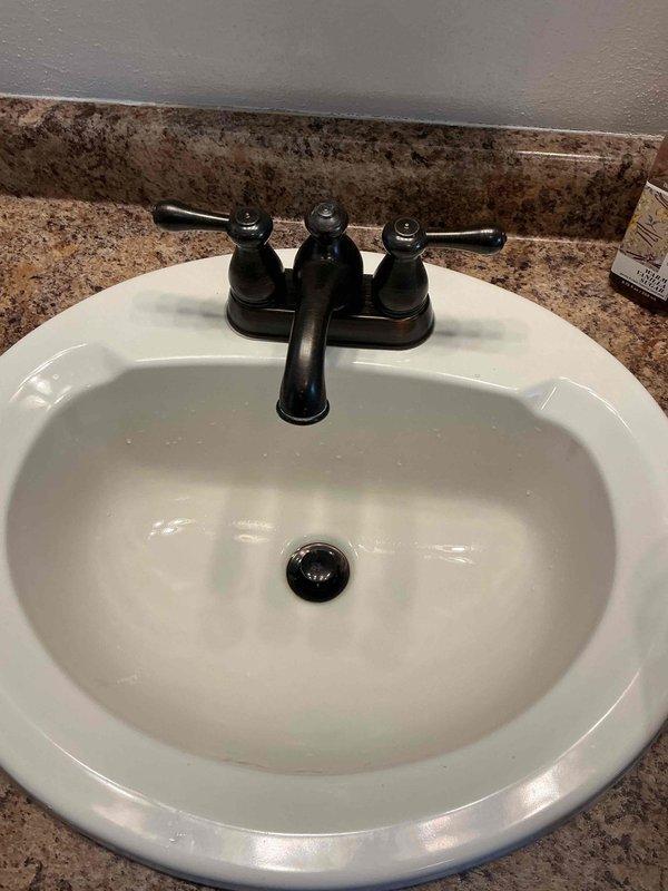 Replaced 20-year-old Mansfield toilet with new Gerber Viper biscuit two-piece standard round toilet. Installation included new wax ring and bolts. Customer opted for replacement rather than multiple repairs to aging fixture.