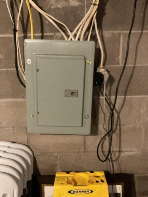 Diagnosed water leakage from 2-year-old Lennox furnace that customer reported has been occurring since installation. Inspection revealed a cracked cold end header box around the screws and trap connection points due to overtightening during original installation. Documented damage with photos showing water damage on concrete floor beneath unit. Submitted warranty part order form for replacement cold end header box.