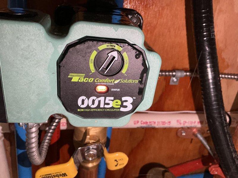 Responded to a no-heat service call for an aging boiler system with severe leakage. Diagnosed a hole in the original circulator pump causing complete system failure (no heat, no hot water). Successfully replaced the damaged unit with a new Taco 0015e3 ECM high-efficiency circulator pump, restoring full system functionality.