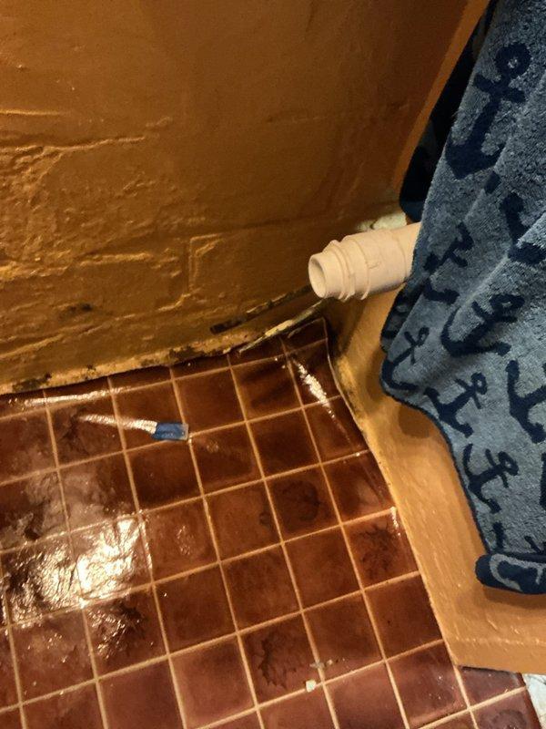 Disconnected and removed two toilets and two bathroom vanities from property that experienced flooding due to frozen pipes while owners were away. Documented existing plumbing conditions with photos, including water supply lines, drain connections, and water damage to surrounding areas. Scheduled follow-up appointment for reinstallation after restoration company completes remediation work.