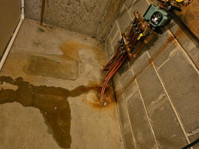 Diagnosed boiler system displaying "LOP" error code due to loss of pressure (0 psi). Located pinhole leak in pump housing causing significant water damage. Replaced defective circulator pump, bled air from system, and restored proper pressure. Remained on site until heat distribution was confirmed with warm returns. System now operating normally.