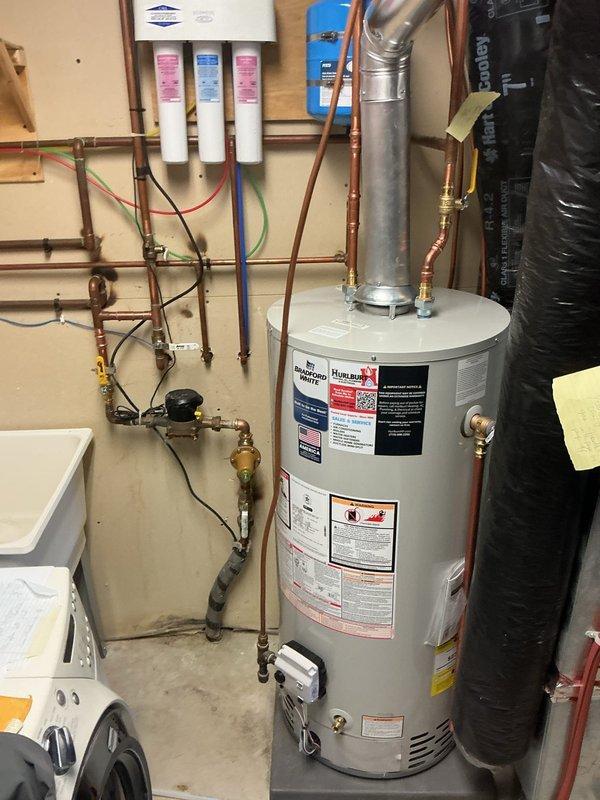 Performed diagnostic inspection on water softener system after customer reported concerns about functionality following inadvertent button pressing. Visual inspection of water softener, hot water heater, and triple-filter water treatment system revealed no operational issues or malfunctions. Reset controls to proper settings and verified system is functioning according to specifications.